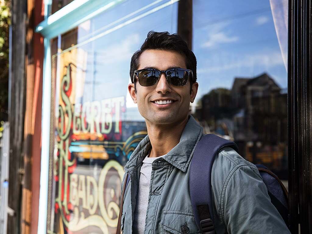 Adult with Invisalign on the go