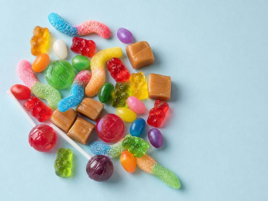 Gummy bears, sour gummy worms, jelly beans, caramels and lollipops